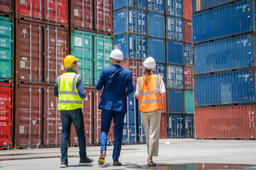 Businessman and engineer or Foreman checking the container to prepare the delivery to the customer.