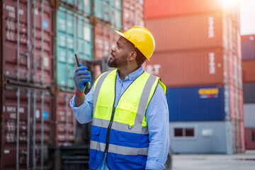 Container operator inspection containers box from cargo ship for export and import at container yards.