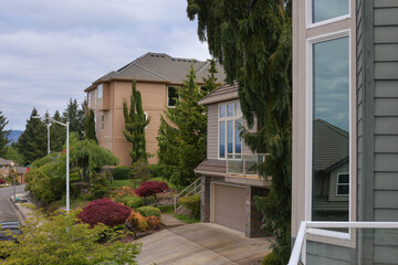 A perfect neighbourhood. Houses in suburb at Summer in the north America. Luxury houses with nice landscape.