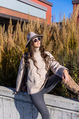 Young confident woman in the city