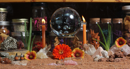 Crystal Ball With Candles and Chakra Stones on Australian Red Sand