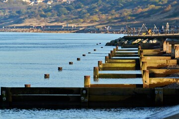 Beautiful view of Groynes at Herne Bay in Kent, UK during sunrise
