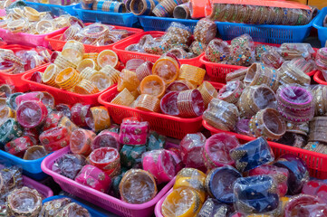 Colorful Rajasthani bangles being sold at famous Sardar Market and Ghanta ghar Clock tower in Jodhpur, Rajasthan, India.