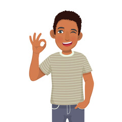 Happy young African man winking showing okay hand sign gestures
