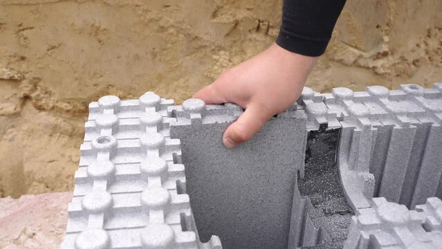Placing piece of ICF block in joint