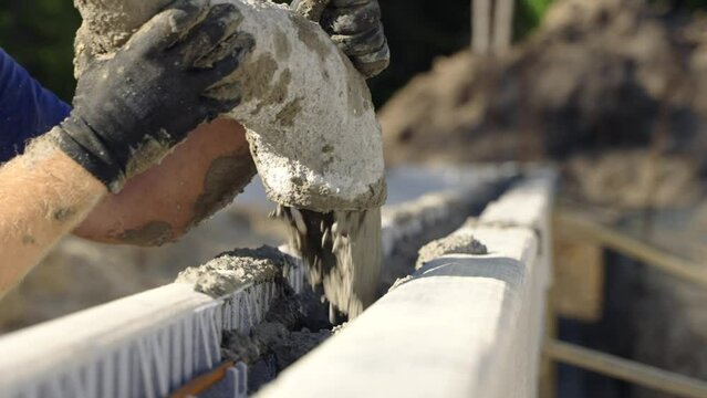 Pouring cement in ICF block