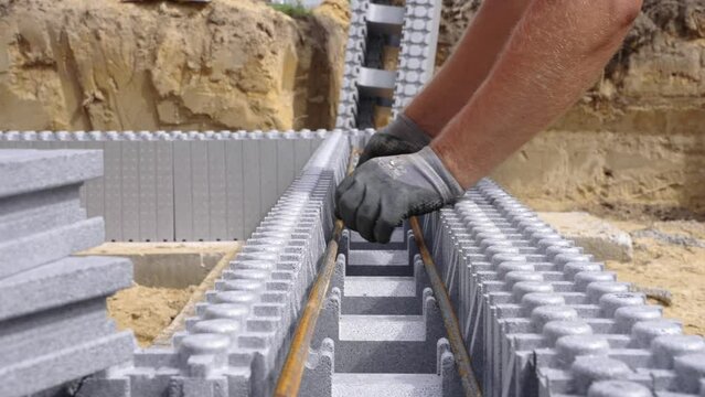 Placing steel bars in ICF block