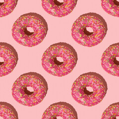 A beautiful bright pattern of red donuts on a pink background.