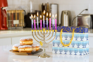 Hanukkah celebration judaism tradition family religious holiday symbols lighting candles on hanukkiah menorah during Hanukkah