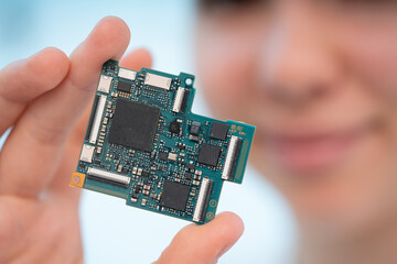 GPU board for laptop in young woman hands
