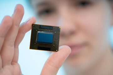 GPU crystal for use in laptops and tablets in the hands of a young woman