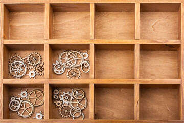 Lot wooden gears on white background, technical progress and movement