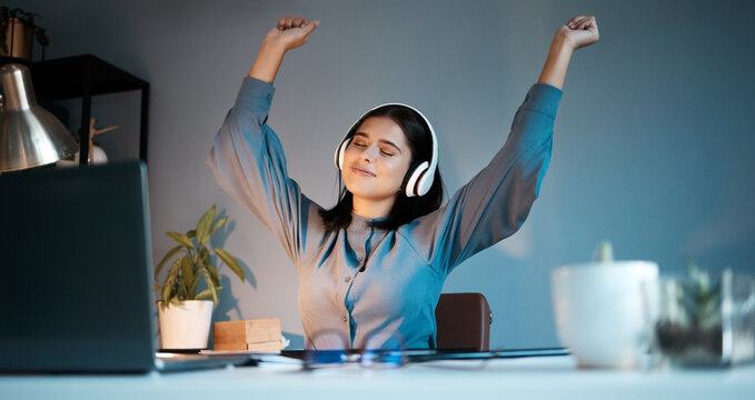 Woman, Night And Dance With Headphones For Music, Stress Relief Or Relax Singing Along Alone At Home. Female Freelancer Relaxing, Listening Or Enjoying Audio Sound Track And Dancing By Workspace Desk