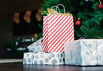 Christmas, gift and tree on floor in home for surprise, giving and celebration in holiday season....