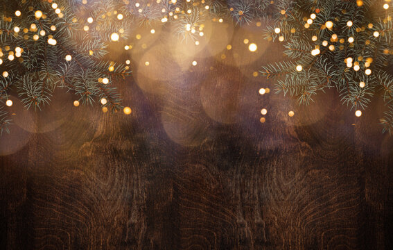 Spruce branch on a wooden background
