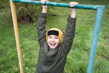 child playing on a swing
