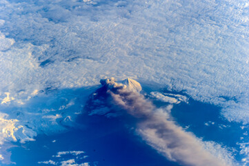 Aerial view from above of Mount Pavlof Volcano erupting in Alaska. Digitally enhanced. Image courtesy of the Earth Science and Remote Sensing Unit, NASA Johnson Space Center.