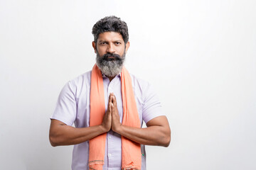 Indian farmer giving expression on white background.