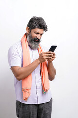 Indian farmer using smartphone on white background. - obrazy, fototapety, plakaty