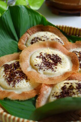 traditional pancake named serabi in a woven plate 