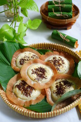 traditional pancake named serabi in a woven plate 