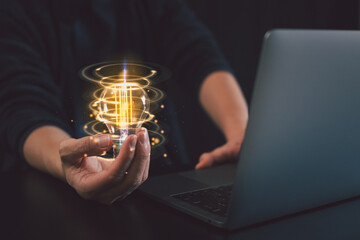Hand holding light bulb. Thinking differently creates inspiration and ideas.New innovations and...