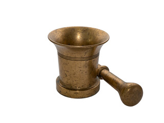 Old brass mortar and pestle lying next to it, isolated. Equipment for grinding and blending...