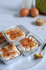 homemade coconut custard cake topped with almond slices and cinnamon 