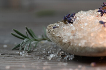 Close up of bath salts and lavender on wooden background