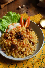 a plate of fried rice with meat 