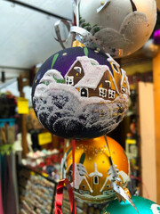 Purple glass Christmas ornament with winter scene