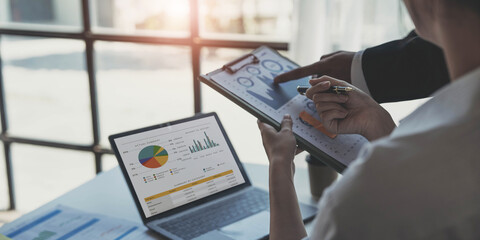 Asian business adviser meeting to analyze and discuss the situation on the financial report in the meeting room.Investment Consultant, Financial advisor and accounting concept