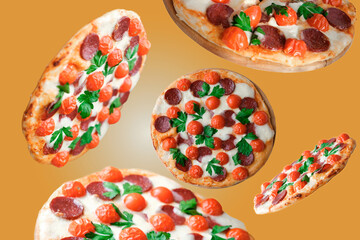 flying pizza on orange background. homemade pizza levitation. italian traditional food. mozzarella and pepperoni fresh pizza.