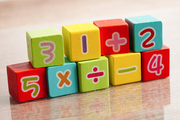 Number wood block cubes for learning Mathematic, education math concept.