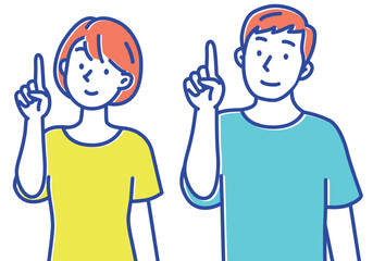 上の方を指差しする若い男女セット