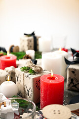 Fototapeta na wymiar Concept of Happy New Year, gift boxes and candles, blurred background