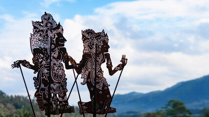 Black shadow silhouette of old traditional puppets of Bali Island - Wayang Kulit. Culture,...