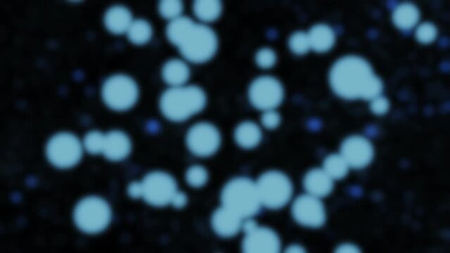 Bokeh blue lights on black great for backgrounds, motion graphics, or compositing. 4K beautifully shot.