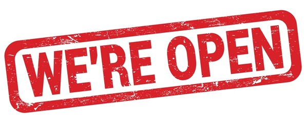 WE'RE OPEN text written on red rectangle stamp.