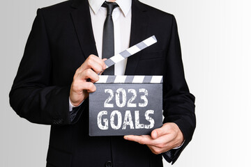 2023 Goals. Businessman showing movie clapper