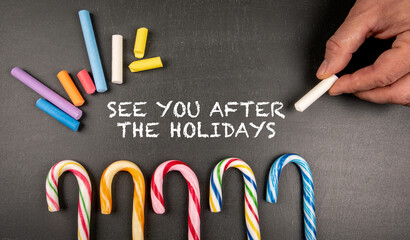 See you after the holidays. Text on a chalk board - obrazy, fototapety, plakaty
