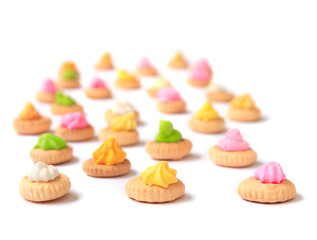 Colorful little cookies on white
