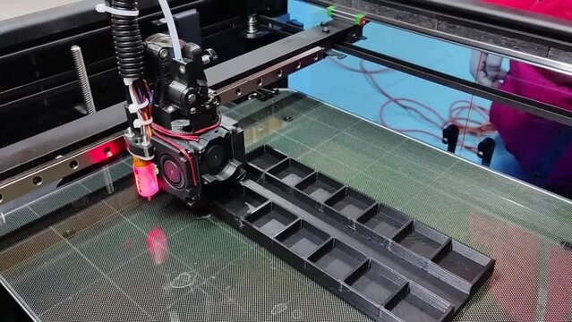 3D printing process. Melting plastic filament that is deposited, via a heated extruder, a layer at a time, onto a build platform
