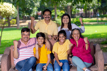 Happy indian or asian family at park