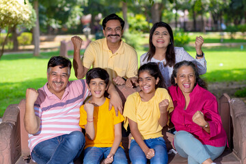 Happy indian or asian family at park