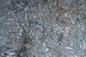 A side of cracked concrete wall