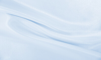 Smooth elegant blue silk or satin luxury cloth texture as abstract background. Luxurious background design