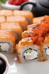 sushi and rolls on an orange background