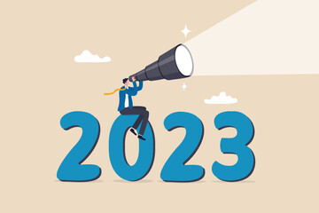 Year 2023 outlook, business opportunity or new challenge ahead, vision to make decision or move forward, plan and perspective concept, confidence businessman look through telescope on year 2023. - obrazy, fototapety, plakaty