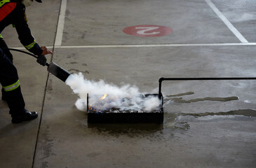 Cropped view of people in fire extinguishing approach training